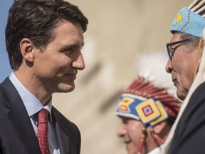 Prime Minster Justin Trudeau is greeted by members of the Saskatoon Tribal Council at White Buffalo Youth Lodge in Saskatoon, Friday, September 1, 2017. THE CANADIAN PRESS/Liam Richards