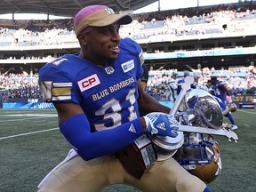 The Winnipeg Blue Bombers' Mo Leggett celebrates his team's Banjo Bowl victory over the Saskatchewan Roughriders on Saturday.