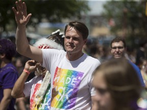 Saskatoon Mayor Charlie Clark walks in the Saskatoon Pride Week parade on June 24, 2017.