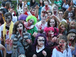 Zombies cross the Broadway Bridge towards the Broadway Theatre during the Dark Bridges Film Festival's 2013 Saskatoon Zombie Walk on September 28, 2013.