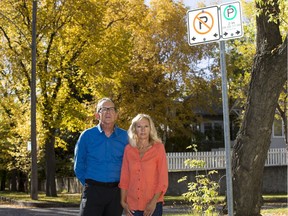 Dennis and Patricia Dowd stand near a parking sign on their street in Saskatoon, SK on Friday, September 29, 2017. The Dowds want the city to reconsider the 36-hour time limit for on-street parking. They feel it puts an unfair burden on homeowners like them who do not have a driveway or a garage and that the limit makes no sense in a city that is trying to encourage residents to walk, cycle and take the bus.