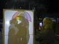 Avery Arseneau takes a photograph of attendants playing with one of many art instillations during the fourth annual Nuit Blanche Festival celebrating art in Saskatoon, September 30, 2017.