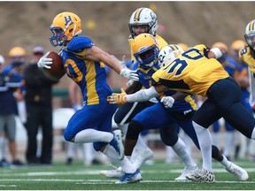 Saskatoon Hilltops' Adam Machart runs for a touchdown during the Canadian Junior Football League Prairie Football Conference game against the Edmonton Wildcats at SMF Field in Saskatoon on Oct. 1, 2017.