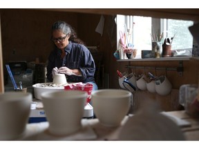 Surrounded by her practical works of art, Tina Morton describes making pottery a quiet, peaceful and grounding process, in her studio just outside of Saskatoon on September 21, 2017. (Michelle Berg / Saskatoon StarPhoenix)