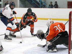 Saskatoon Contacts' Chase Hamm blocks a shot in the first match against the Saskatoon Blazers' Cole Nagy this season in the Saskatchewan Midget AAA Hockey League at Rod Hamm Arena. in Saskatoon on October 8, 2017.