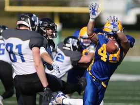 Saskatoon Hilltops' Bobby Ehman attempts a punt block during the Canadian Junior Football LeagueÕs Prairie Football Conference semifinal against the Winnipeg Rifles at SMF Field in Saskatoon on October 15, 2017.