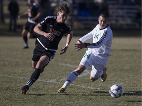 Thompson Rivers defensemen Jan Pirretas Glasmacher fights for the ball against Huskies striker Tyler Redl during the game at PotashCorp Park in Saskatoon, SK on Friday, October 27, 2017.