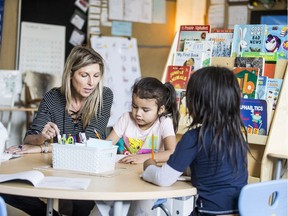 Teacher Lara Loraas and and student Sierra work on brand new desks and chairs at Mayfair School in Saskatoon, Sask. on Friday, Oct. 27, 2017. Officials with the division say the new furniture will help improve learning outcomes and environments for students and staff.