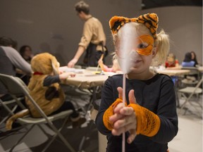 Eya Paulgaard, age 3, makes a craft at the annual Boo Town Halloween event at Boomtown inside the Western Development Museum in Saskatoon, SK on Monday, October 30, 2017. (Saskatoon StarPhoenix/Liam Richards)