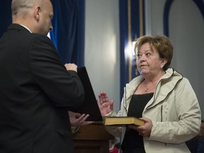 Donna Harpauer takes an oath during a cabinet shuffle at Government House. She became finance minister.