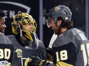 Marc-Andre Fleury #29 and James Neal #18 of the Vegas Golden Knights celebrate their 5-2 victory over the Arizona Coyotes during the Golden Knights' inaugural regular-season home opener at T-Mobile Arena on October 10, 2017 in Las Vegas, Nevada. The Golden Knights defeated the Coyotes 5-2.  (Photo by Bruce Bennett/Getty Images)