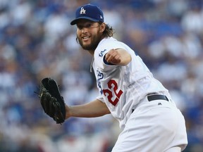 Clayton Kershaw of the Los Dodgers watches his pitch during Game 1 of the World Series against the Houston Astros at Dodger Stadium in Los Angeles on Tuesday night.