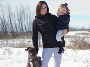 Cindy Davis is pictured with her daughter and their dog, a pitbull/mastiff, Aspen. Aspen was declared dangerous on Dec. 1, 2016. Now, a retrial has been ordered after the Justice of Peace who heard the case in Sept. 2016 made an error. A new trial has been ordered for Jan. 4, 2018.