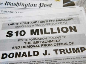 A photo taken on October 15, 2017 in in Washington, DC shows a full-page newspaper advertisement in the Washington Post offering 10 million dollars from Hustler Magazine publisher Larry Flynt.