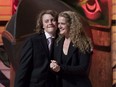 Laurier Payette Flynn hugs his mother Governor General Julie Payette as Prime Minister Justin Trudeau, not shown, speaks during a reception at the Canadian Museum of History in Gatineau on Monday, Oct. 2, 2017.
