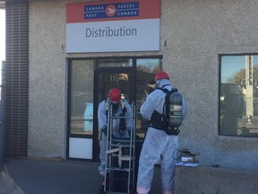 Members of the Saskatoon Fire Department, who are dangerous goods trained, deal with suspicious package discovered at the Canada Post distribution centre on Avenue H on Oct. 5, 2017.