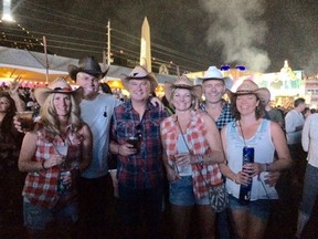 Todd, second from right, and Elan Lawrence, right, attended the Route 91 Harvest Music Festival in Las Vegas Sunday. The Weyburn couple, pictured here with friends Kerri Robins, Jerry LaFoy, Darren Larson and
Teresa LaFoy, escaped from the shooting without injuries. Submitted photo