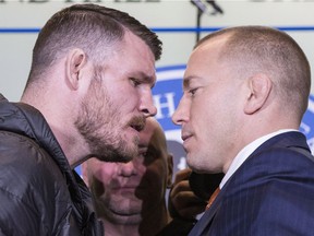 Canadian fighter Georges St-Pierre (right) and British fighter Michael Bisping square off as they promote UFC 217 during a news conference in Toronto on Friday October 13, 2017. THE CANADIAN PRESS/Chris Young ORG XMIT: CHY102
Chris Young,