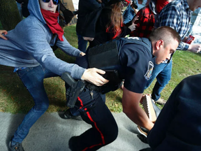 Tensions rise as protesters clash with police on Saturday Sept. 30, 2017 in Peterborough, Ont.