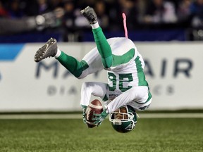 Saskatchewan Roughriders Christion Jones flips into the end zone for a touchdown against the Calgary Stampeders during CFL football on Friday, October 20, 2017.  (Al Charest/Postmedia)