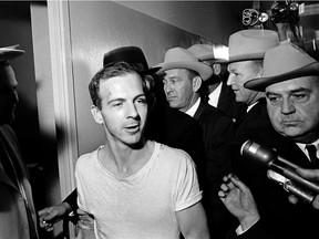 FILE - In this Nov. 23, 1963, file photo, surrounded by detectives, Lee Harvey Oswald talks to the media as he is led down a corridor of the Dallas police station for another round of questioning in connection with the assassination of U.S. President John F. Kennedy. President Donald Trump is caught in a push-pull on new details of Kennedy's assassination, jammed between students of the killing who want every scrap of information and intelligence agencies that are said to be counseling restraint.  How that plays out should be known on Oct. 26, 2017, when long-secret files are expected to be released. (AP Photo) ORG XMIT: WX401

A NOV. 23, 1963, FILE PHOTO
AP