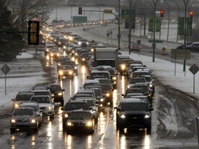 Traffic on Circle Drive is slowed down by wet and snowy conditions