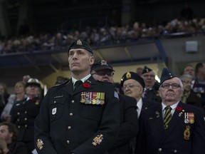 Veterans stand in the crowd to be honoured during one of Canada's largest indoor Remembrance Day services at SaskTel Centre in Saskatoon on Saturday, Nov. 11, 2017.