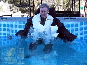 The dean of the Edwards School of Business at the University of Saskatchewan, Keith Willoughby, takes the icy plunge after The Edwards JDC West Team raised $7,500 to ÒDunk the DeanÓ in Saskatoon on November 2, 2017.