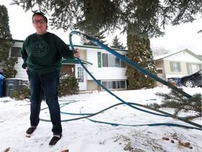 University student Emily Barteaux lifts up one of the hoses that froze and stopped supplying her house with water. Over the summer there was a water main break in her street and city crews started pumping water into the house she rents with a rubber hose. Emily and her three roommates spent last weekend without water and would go to the university to use the showers.(Michelle Berg / Saskatoon StarPhoenix)
Michelle Berg, Saskatoon StarPhoenix