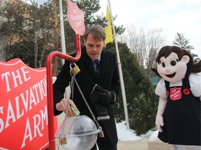 Among the melodic sounds of holiday music played by the Salvation Army Band, Saskatoon Mayor Charlie Clark made the first donation to the Saskatoon Salvation Army's Kettle Campaign on Nov. 16, 2017.