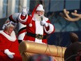 Santa Claus waves to the screaming children for the big finale at the Santa Claus Parade in Saskatoon on November 19, 2017.