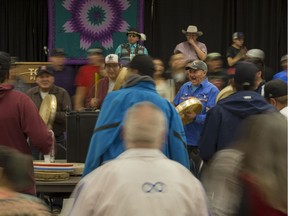 People take part in a round dance being held for families participating in the National Inquiry into Missing and Murdered Indigenous Women and Girls in Saskatoon, SK on Wednesday, November 22, 2017. (Saskatoon StarPhoenix/Liam Richards)