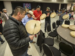 People take part in a round dance being held for families participating in the National Inquiry into Missing and Murdered Indigenous Women and Girls in Saskatoon on Wednesday, November 22, 2017.