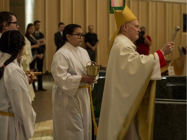Most Rev. Mark Hagemoen, right, enters the Cathedral of the Holy Family church prior to his installation as Bishop of the Saskatoon Roman Catholic diocese in Saskatoon on Thursday, November 23, 2017.