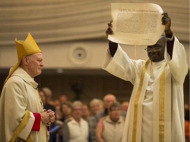 Most Rev. Mark Hagemoen, left, during the bearing of the Apostolic Letter in his installation as Bishop of the Saskatoon Roman Catholic diocese in Saskatoon on Thursday, November 23, 2017.