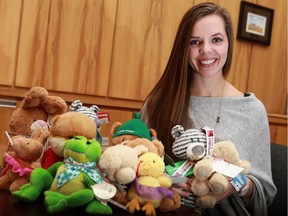 Miren Luczka poses with stuffed animals for the Plush Bear Program at the StarPhoenix in Saskatoon.