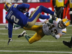 Winnipeg Blue Bombers' Matt Coates (2) makes it across the line for the two points despite getting hit by Edmonton Eskimos' Neil King (43) during second half CFL western semifinal action in Winnipeg on Sunday, November 12, 2017. THE CANADIAN PRESS/John Woods