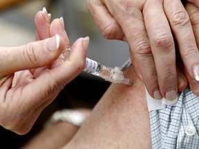 Public health officials are urging residents to get the flu vaccine. File photo/ Postmedia Network  ORG XMIT: POS1701051720592948 ORG XMIT: POS1701061549130025

Postmedia
Luke Hendry, Postmedia