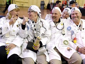 CFL fans Irene Cooke, from left, Lois Bastedo, Ricky McLachlan, Jann McLachlan, and Rob Cooke hang out during the Grey Cup Festival at the Aberdeen Pavilion in Ottawa on Friday, Nov. 24, 2017. The friends, dressed as a play on words of the TV show Grey's Anatomy, cheer for multiple teams in the Eastern Division, but will be cheering for the Toronto Argonauts in the 105th Grey Cup.