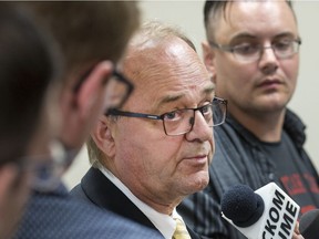 Former environment minister Herb Cox speaks with reporters after announcing Yancoal Canada Resources Co.'s Southey potash mine proposal had been granted environmental approval.