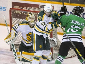 SASKATOON, SASK--MARCH 5 2016 0307 Sports Huskies Men Hockey- University of Alberta Golden Bears goalie Luke Siemens looks up as the puck goes off the head of defence Jordan Rowley as University of Saskatchewan Huskies forward Michael Sofillas puts on pressure during 2nd period CIS Men's Hockey action on Saturday, March 5th, 2016. (Liam Richards/Saskatoon StarPhoenix)
Liam Richards, Saskatoon StarPhoenix