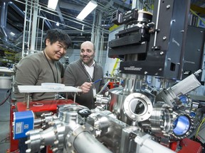 Juan Ianowski (right) and Xiaojie Luan have used powerful synchrotron X-rays to study a disease-spreading insect. (photo by Dave Stobbe for the University of Saskatchewan)