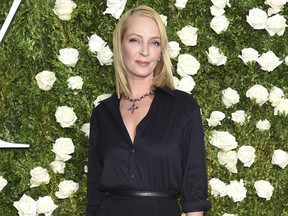 FILE - In this June 11, 2017 file photo, Uma Thurman arrives at the 71st annual Tony Awards in New York. Thurman wished everyone a happy Thanksgiving except disgraced movie mogul Harvey Weinstein, saying in a cryptic online post that he doesn't "deserve a bullet." Thurman starred in the Weinstein-produced films "Pulp Fiction" and the "Kill Bill" films. (Photo by Evan Agostini/Invision/AP, File)