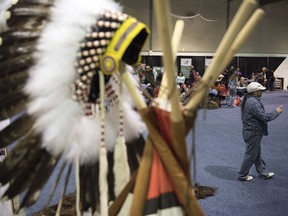 Elder Dennis Omeasoo takes part in storytelling at the Indigenous Pavilion during the Canadian Western Agribition in Regina.