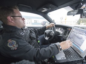 Const. Curtis Warnar, a member of the Regina Police Service traffic unit, on regular traffic patrol in Regina.