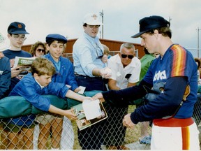Terry Puhl signs autographs for fans during his playing days with the Houston Astros.