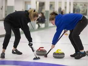 Bishop Mahoney curlers Lydia Zukewich and Teri Auser sweep during a match earlier this month.