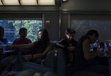 Young people 25 and under qualified for a free month-long VIA Rail pass for Canada 150. Here, several of them relax in the communal car heading east.