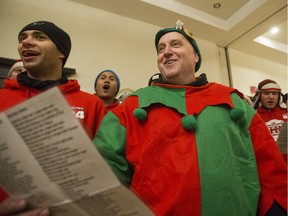 Saskatoon firefighters sing Christmas carols in the ballroom of the Hilton Garden Inn in Saskatoon, SK on Friday, December 15, 2017. Since 1984 they have been travelling around the city singing Christmas carols and collecting donations to support the Secret Santa Foundation.