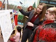 Amanda McReynolds Doran, PotashCorp Children's Discovery Museum Executive Director, shows Donna Francis, Regional Vice President, Saskatoon Market, BMO Bank of Montreal, what the new Airways exhibit will look like at the Children's Discovery Museum in Market Mall in Saskatoon on December 18, 2017.